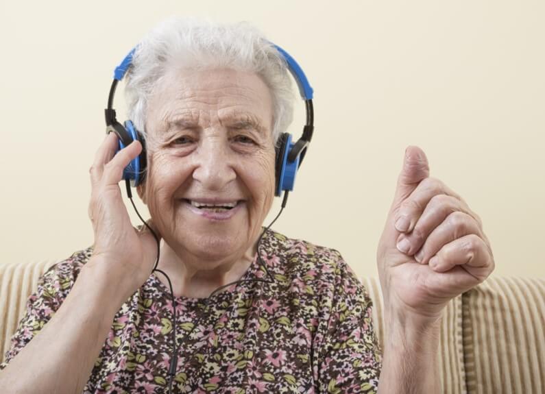  Senior citizen listening to music at home 